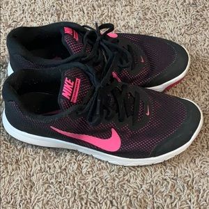 Pink and black Nike shoes